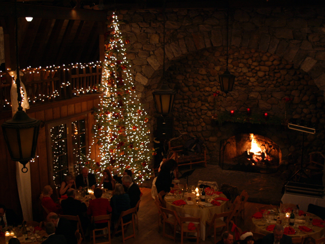 Christmas tree inside Valhalla Grand Hall with guests at party
