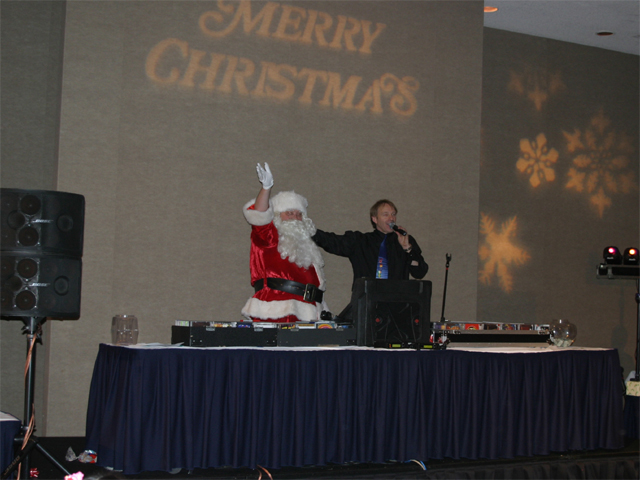 DJ introducing Father Christmas at a Christmas party