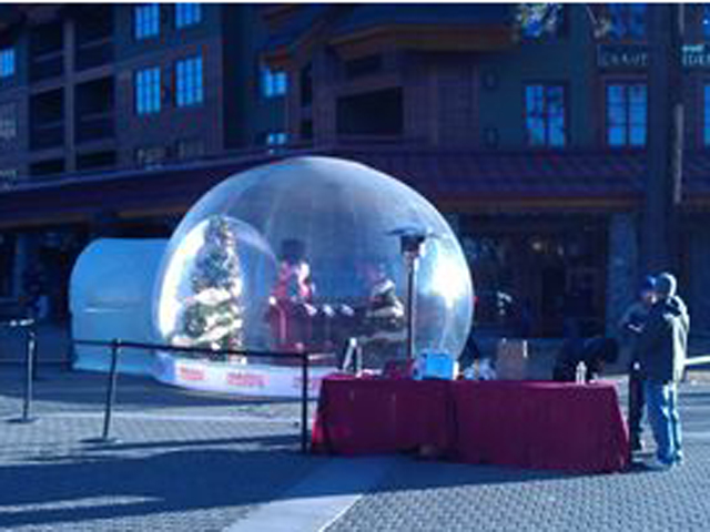Santa’s workshop inside a 16-foot snow globe